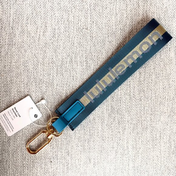 NEW Lululemon Never lost Keychain Wordmark Warp Teal Gold Blue - Picture 1 of 9